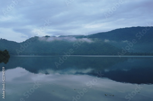 landscape of mountain with mist floating in lake © pedphoto36pm