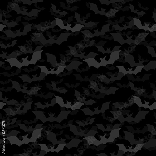 Halloween seamless pattern with bats flying out of the darkness