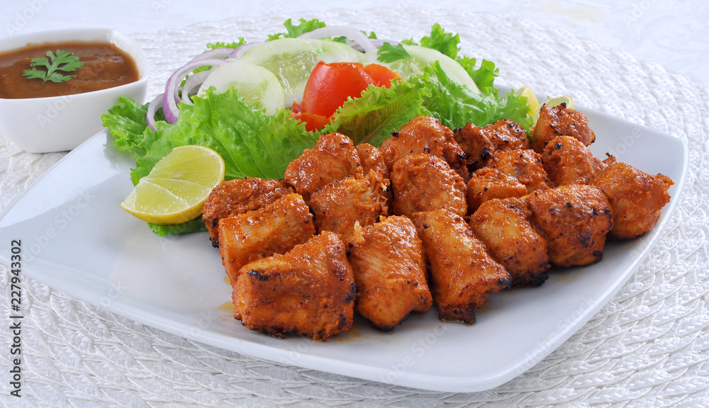Chicken Boti Kebab, Delicious spicy and marinated boneless chicken meat cooked on charcoal flame. Chicken Boti Kebab, Delicious spicy and marinated boneless chicken meat cooked on charcoal flame.