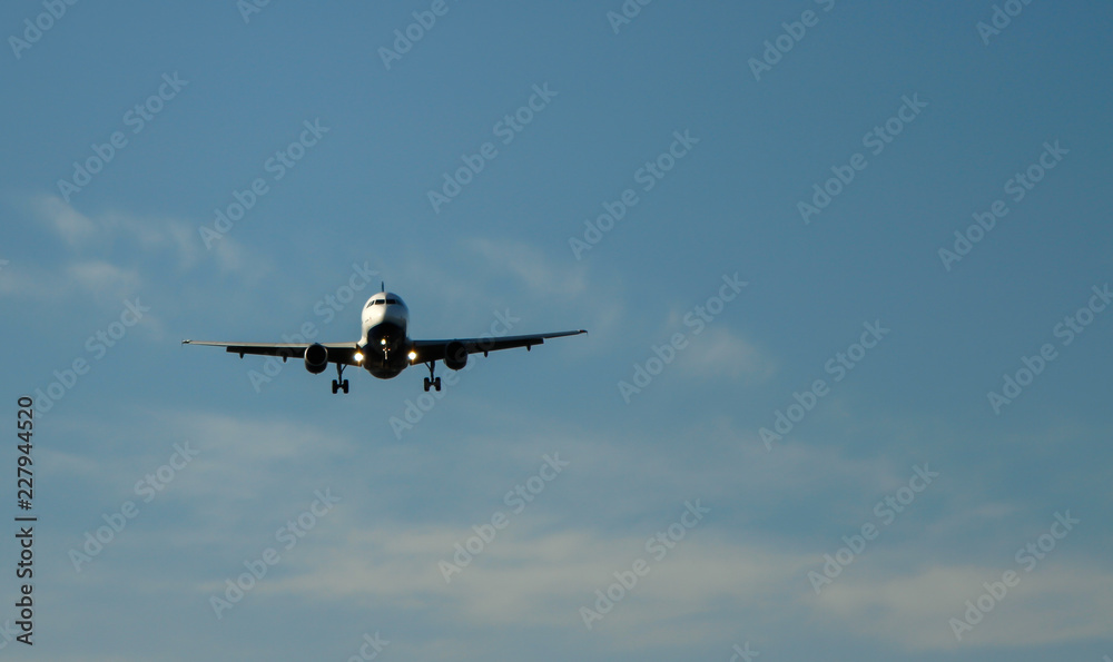 Jet airplane flying overhead to land