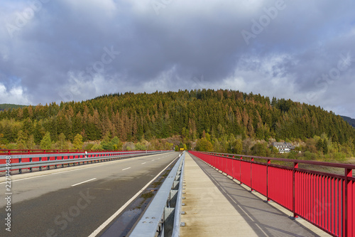 Bridge crossing the Okerstausee Okertalsperre reservoir in National Park Harz Germany photo