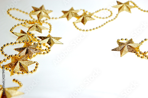 Golden stars. Christmas and New Year holiday background concept. Blank space for greetings.