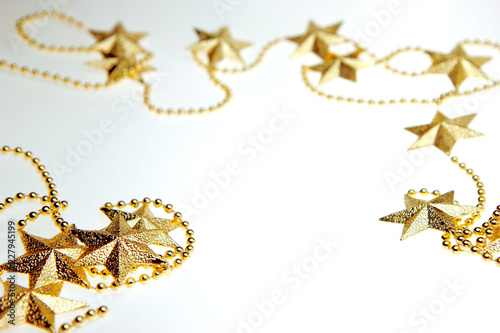 Golden stars. Christmas and New Year holiday background concept. Blank space for greetings.