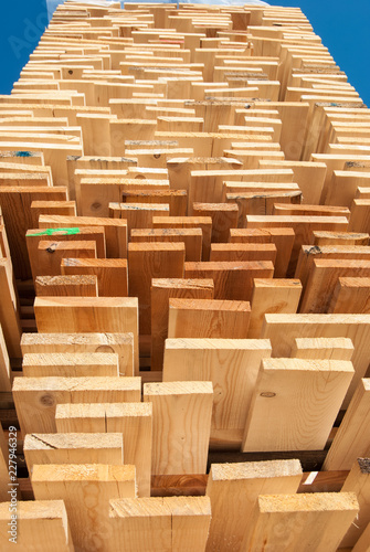 High stack ordered of wooden boards
