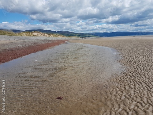 Beach landscape scene in Talybont, North Wales on a summer day. photo