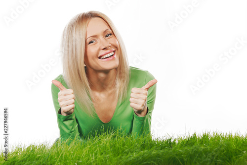 Woman on grass with thumbs up