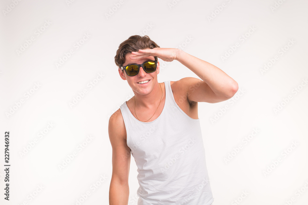 Handsome funny man in sunglasses over white background with copy space Handsome funny man in sunglasses over white background with copy space