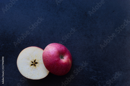 Slice apple on black background,