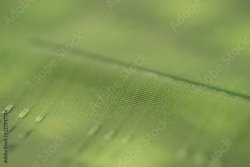 Green fabric texture. Green cloth background. Close up view of green fabric texture and background. Abstract background and texture for designers.