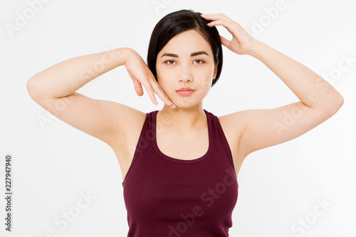 Skin care and armpit concept. Make up and cosmetics. Young asian woman isolated on white background in summer shirt. Copy space. © ladyalex