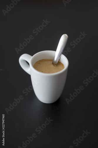 cup of coffee on a black table