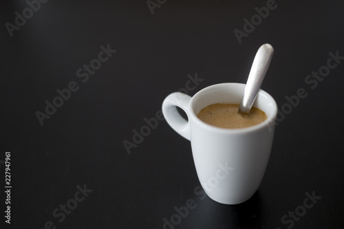 cup of coffee on a black table