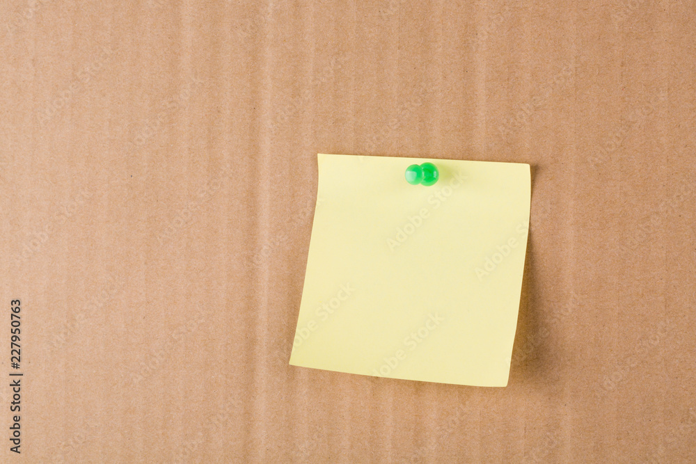 Fototapeta premium Post-It Note and Push Pin on Yellow