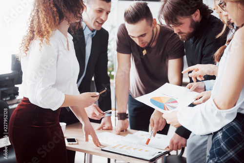 Successful business people are talking and smiling during in office.