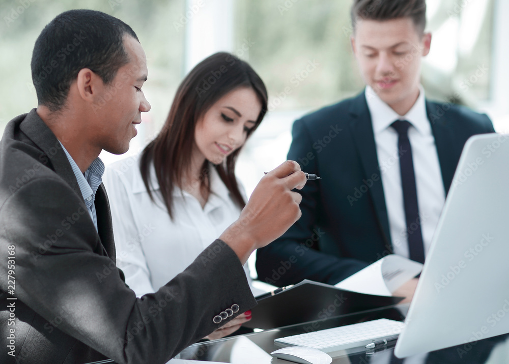 employees discussing new ideas in a modern office.t employees discussing new ideas in a modern office.t