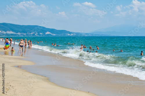 Asprovalta, Greece - August 20, 2018: Asprovalta and New Vrasna resort, Asprovalta beach. Sea view to Asprovalta at the foot of the green hills. © nedomacki