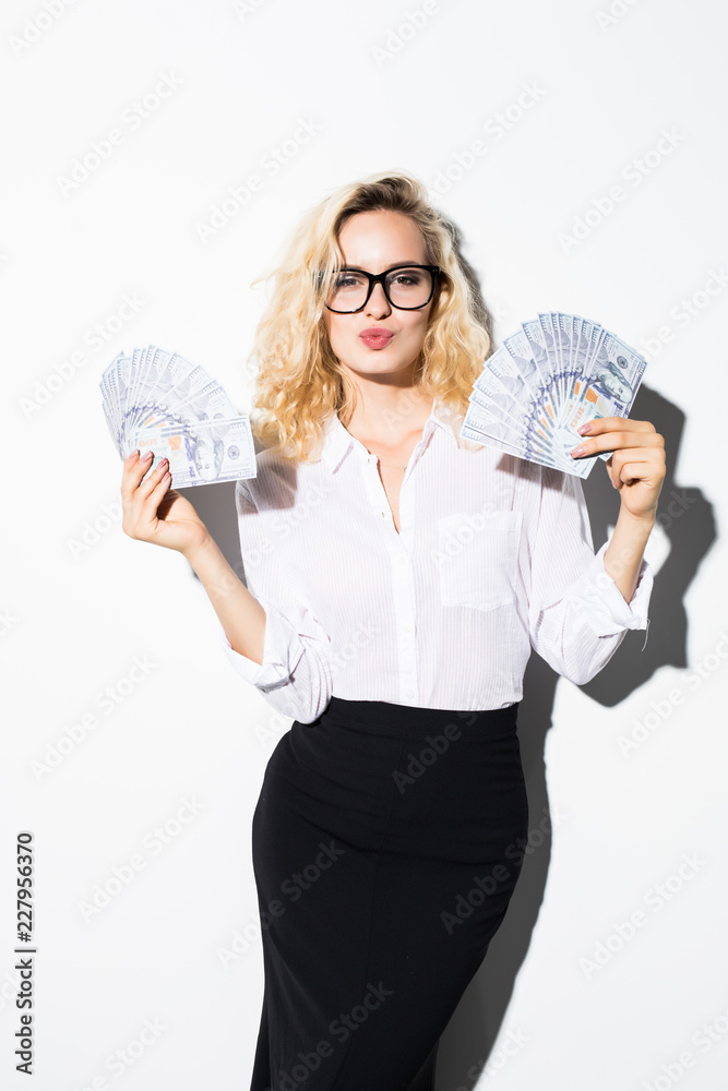 Young businesswoman holding money with smile isolated on white background. Young businesswoman holding money with smile isolated on white background.