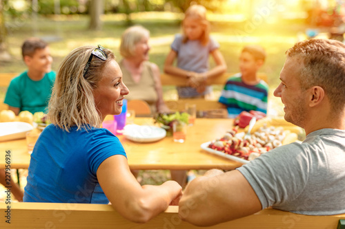 happy family makes a barbecue outside