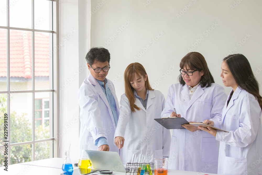 Sciene Test. Chemist scientific testing quality. Group Scientist working at laboratory. One Man and Three woman at chemistry lab. Asian people. Sciene Test. Chemist scientific testing quality. Group Scientist working at laboratory. One Man and Three woman at chemistry lab. Asian people.