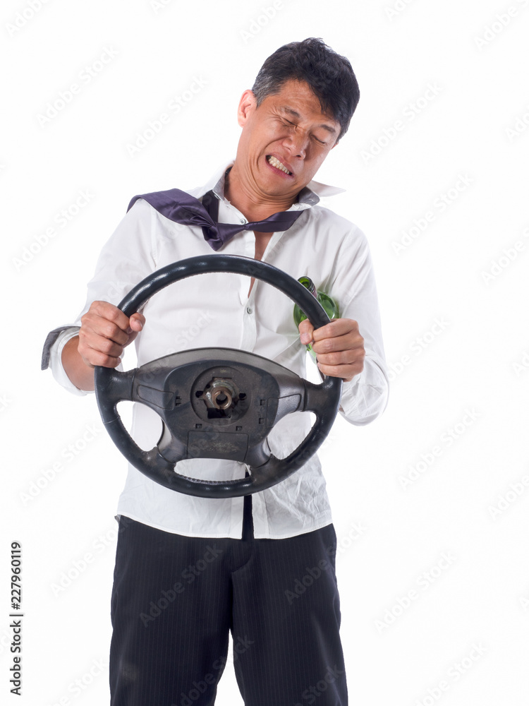 drunk business man wear black suit holding wine bottle and steering wheel on isolated white background drunk business man wear black suit holding wine bottle and steering wheel on isolated white background