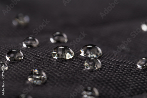Water drops on waterproof black fabric photo