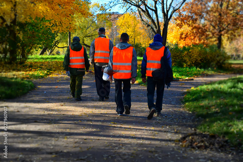 people walking in autumn park