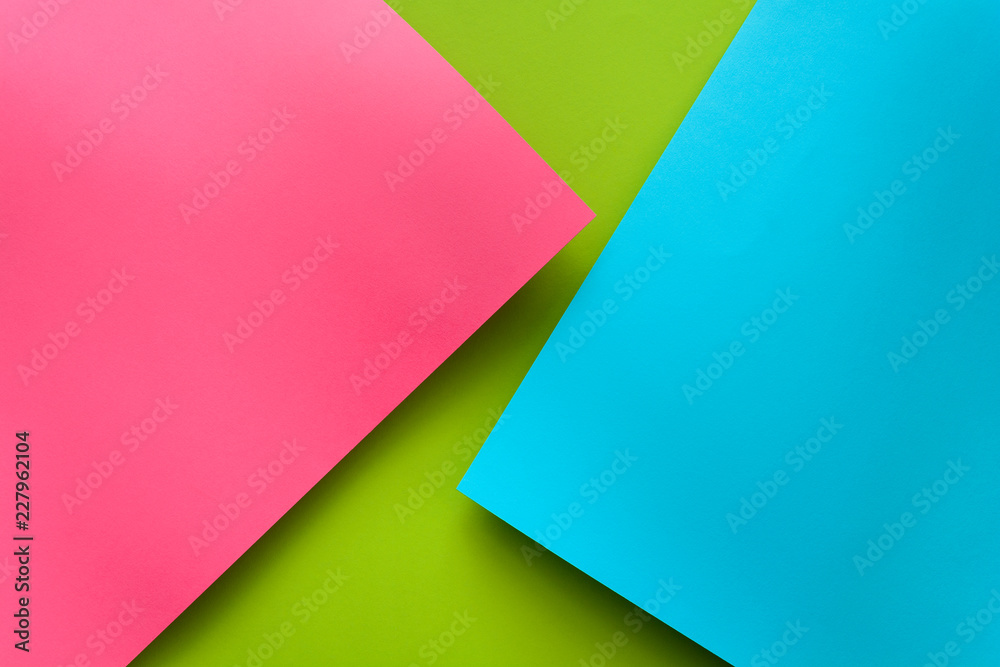 Blue, green and pink pastel colored paper background. Volume geometric flat lay. Top view. Copy space