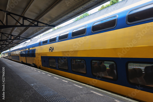 Train awaiting departure along the platform in the famous Haarlem train station