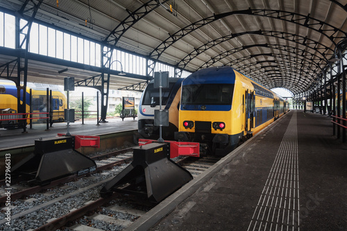 Trains awaiting departure along the platform in the famous Haarlem train station