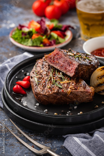 Steak beef. Beef steak medium with red pepper, aromatic herbs and fried onion