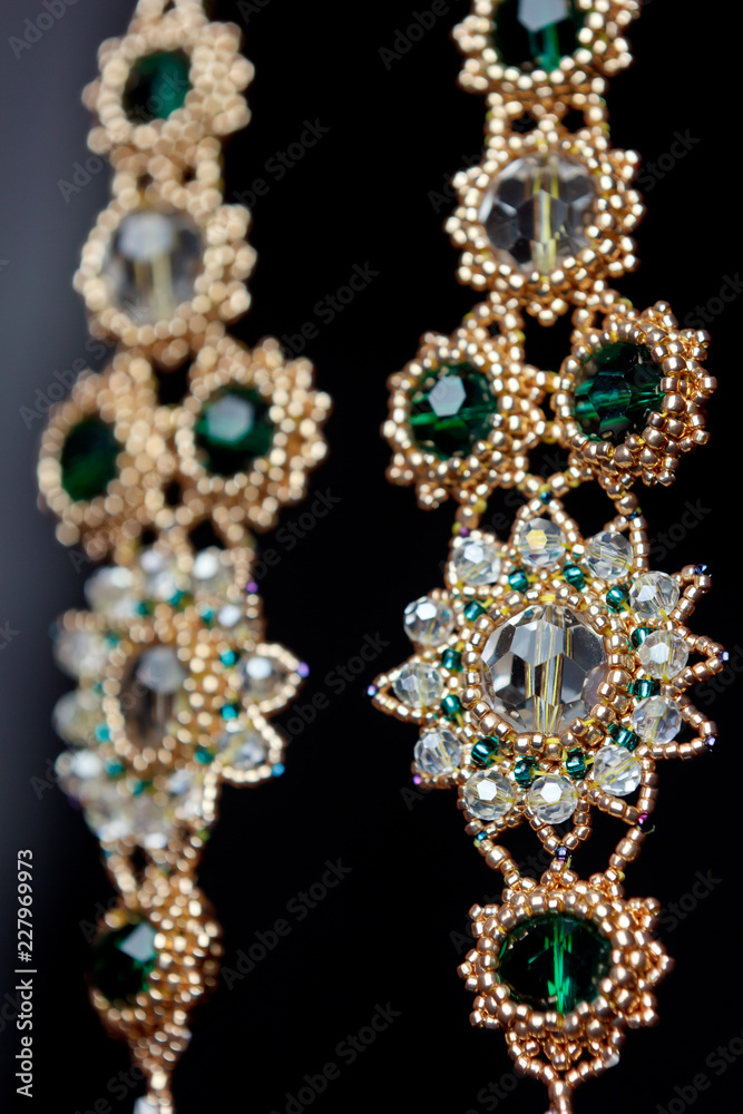 handmade jewelry made of beads in macro. earrings from white beads. earrings from stones handmade jewelry made of beads in macro. earrings from white beads. earrings from stones
