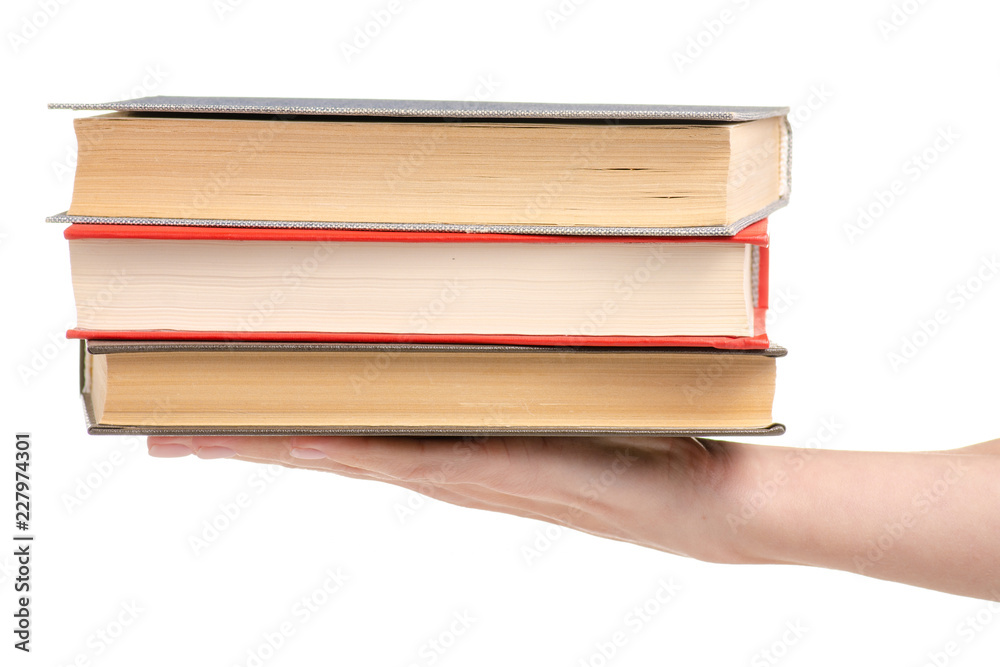 Stack of books in hand on a white background isolation Stack of books in hand on a white background isolation