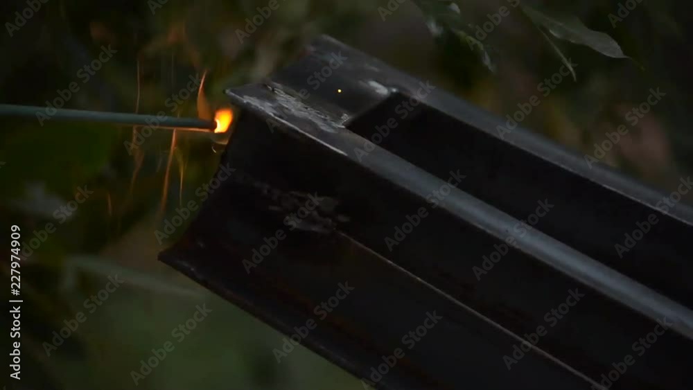 Electric welding of metal frame outdoors Electric welding of metal frame outdoors