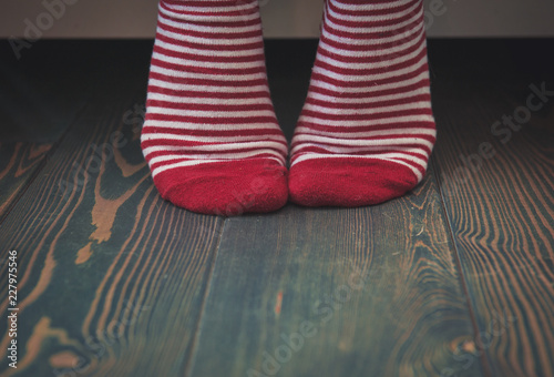 Woman wearing red socks on the floor. Template for design