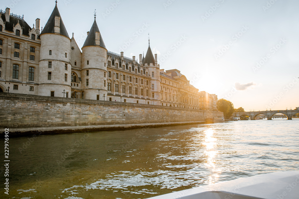 Landscape view on the riverside from the boat sailing on Seine river during the sunset in Paris