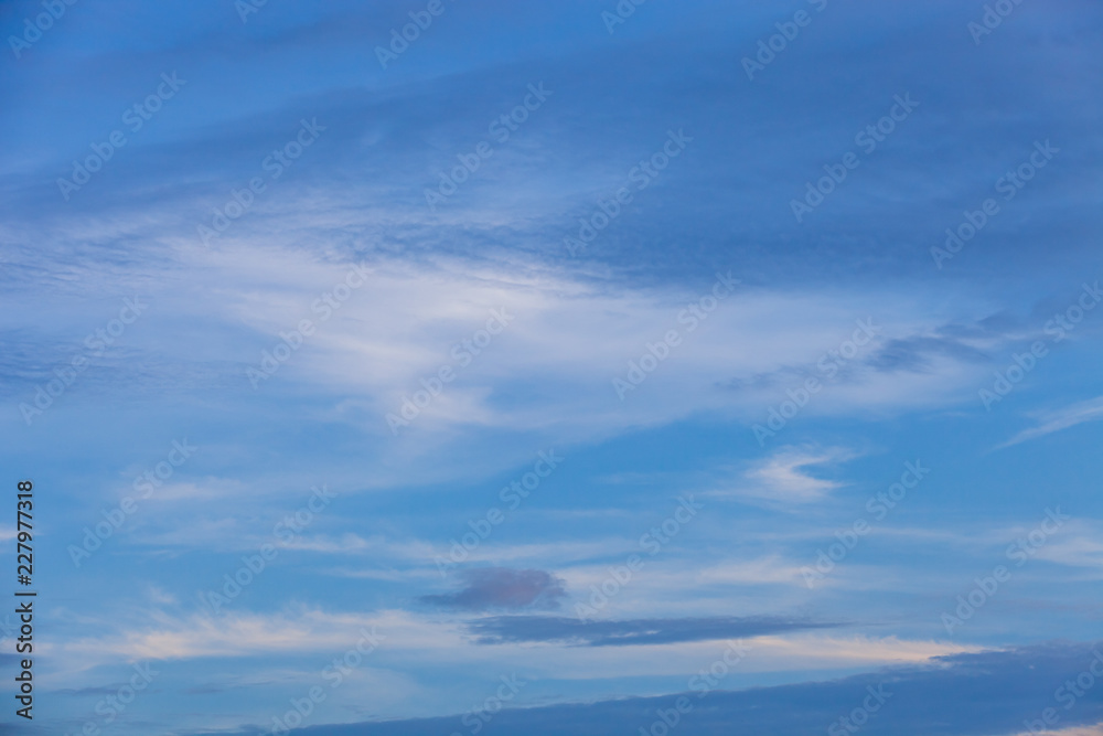 sky background with nice clouds on bright blue sky