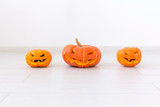 Halloween pumpkins. Funny Jack O'Lantern on the light room