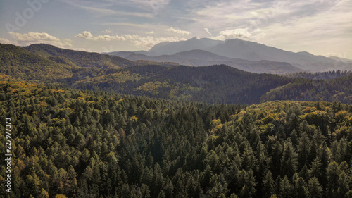 Aerial view of beautiful Transylvania. Carpathian mountains in autumn  sunset with beautiful collors and clouds.