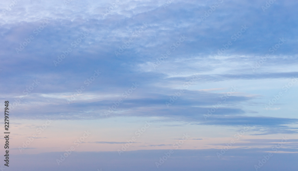 sky background with nice clouds on bright blue sky