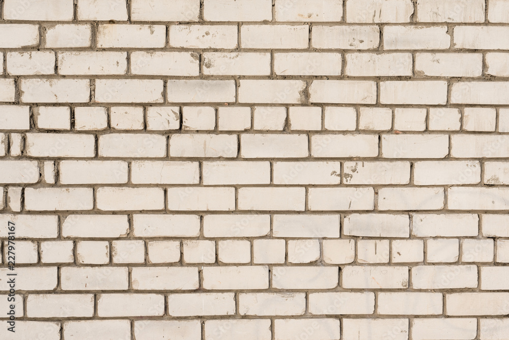 Brick texture with scratches and cracks. It can be used as a background Brick texture with scratches and cracks. It can be used as a background