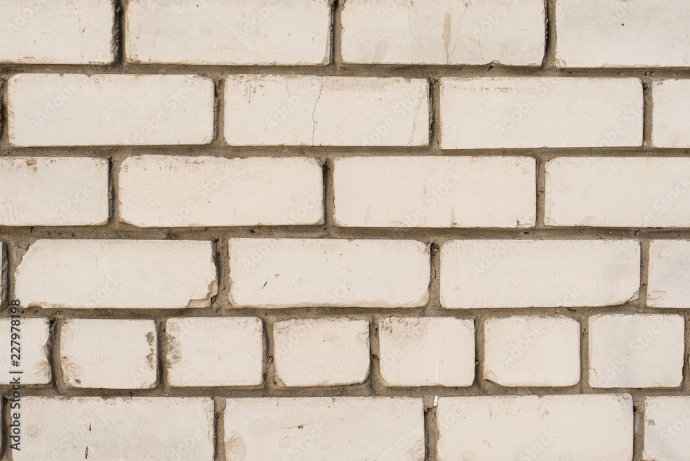 Brick texture with scratches and cracks. It can be used as a background Brick texture with scratches and cracks. It can be used as a background