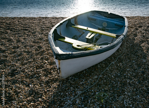 Dimghy on stoney beach photo