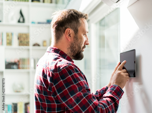 Man using smart home device