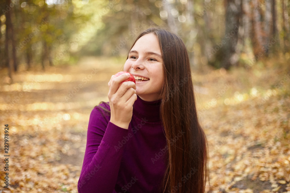 Charming girl with a red apple. Charming girl with a red apple.
