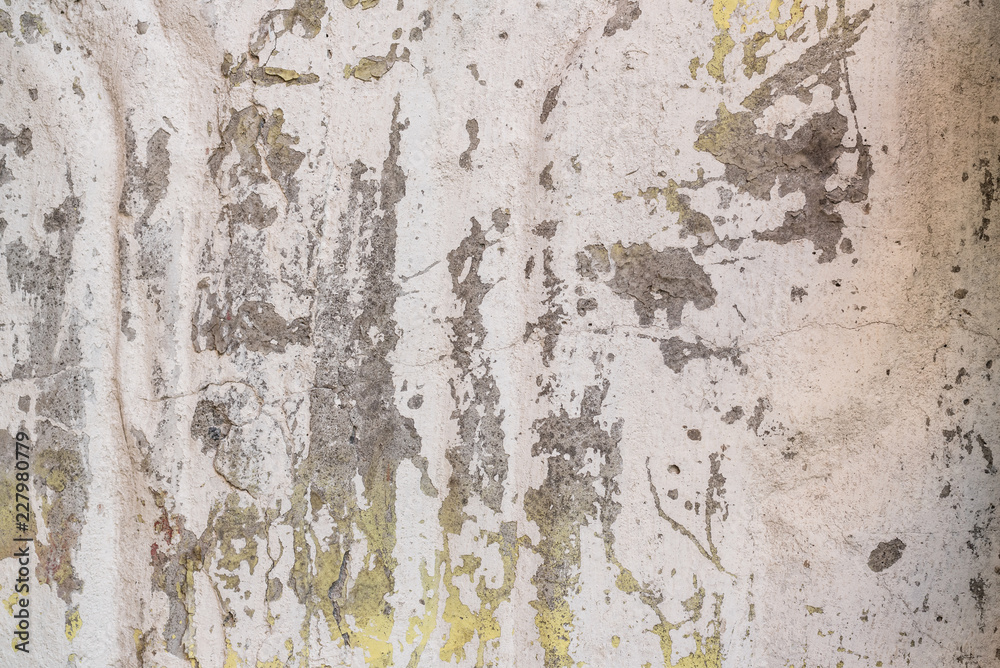 Wall fragment with scratches and cracks. It can be used as a background Wall fragment with scratches and cracks. It can be used as a background