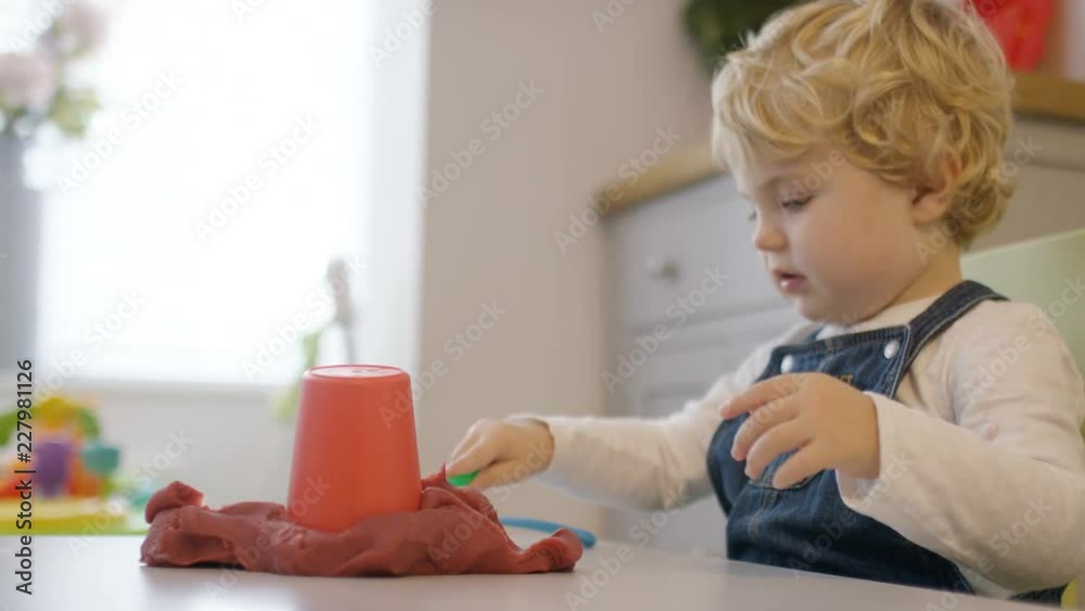 Little boy playing with play dough at home Little boy playing with play dough at home
