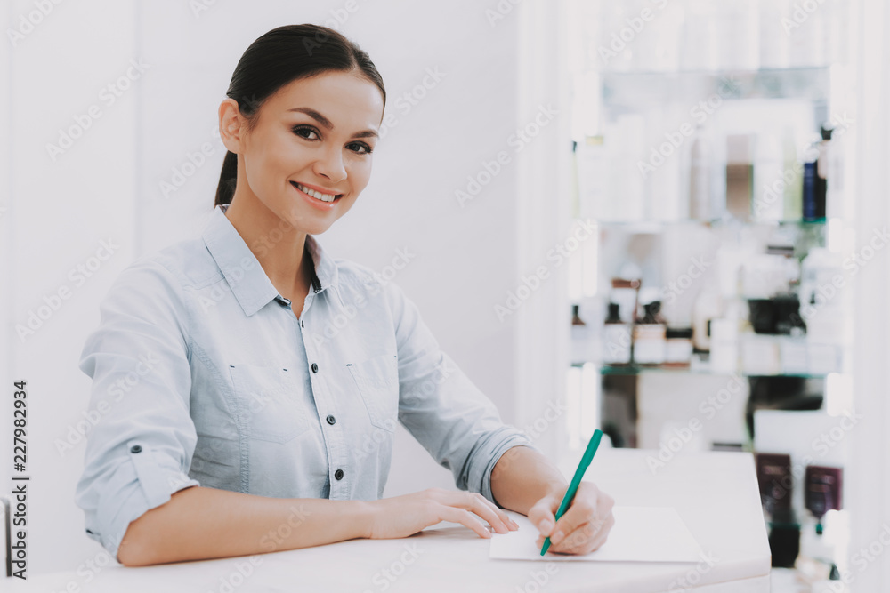 Woman Receptionist in Workplace in Beauty Salon. Woman Receptionist in Workplace in Beauty Salon.
