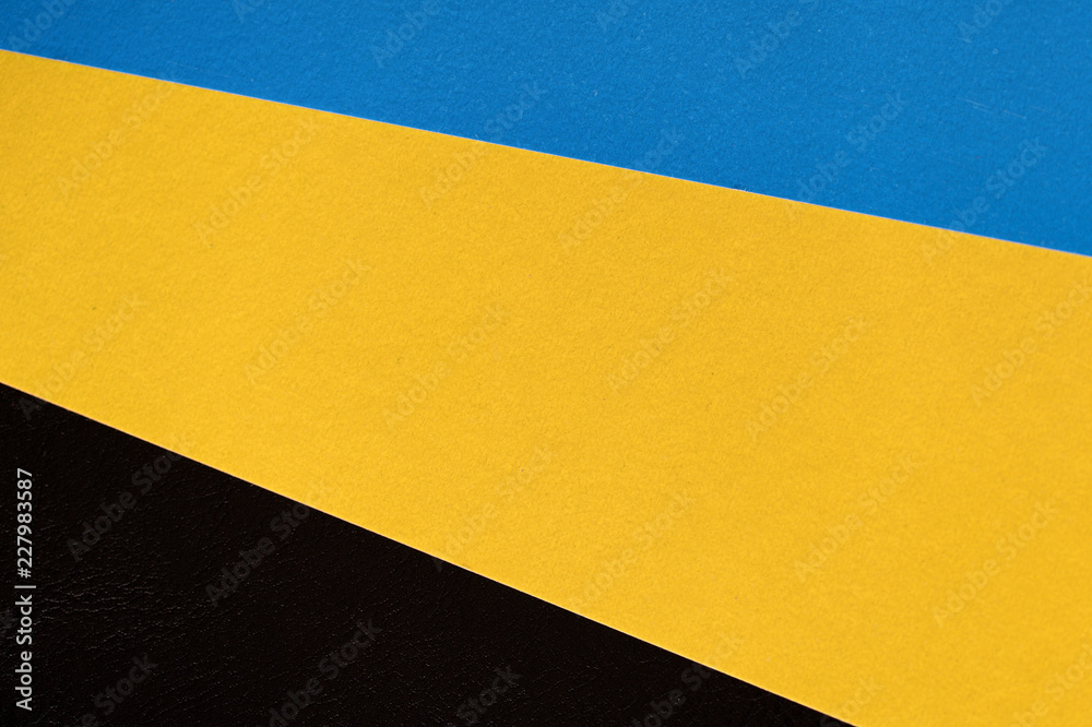 Colorful sheets of paper on a dark background close up Colorful sheets of paper on a dark background close up