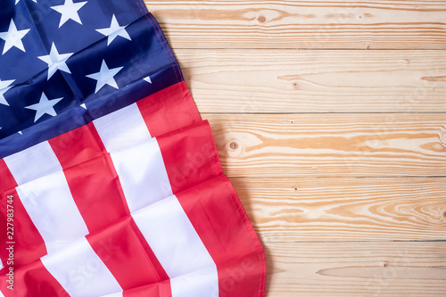 flag of the United States of America on wooden background. USA holiday of Veterans, Memorial, Independence and Labor Day. copy space for text