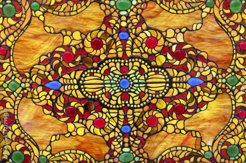 Stained glass window with colorful oriental ornament.
